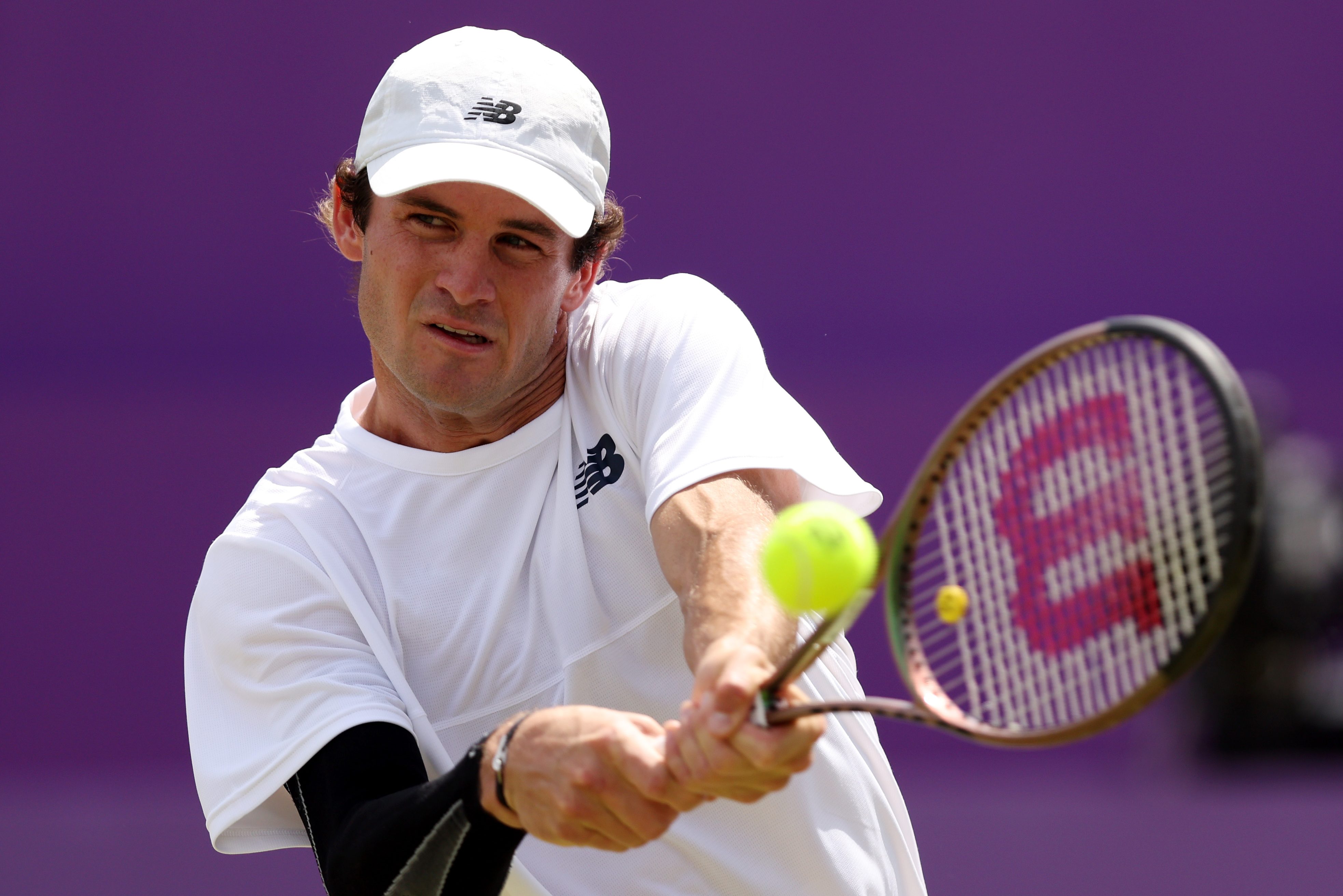 Tommy Paul plays a backhand shot against Stan Wawrinka of Switzerland.