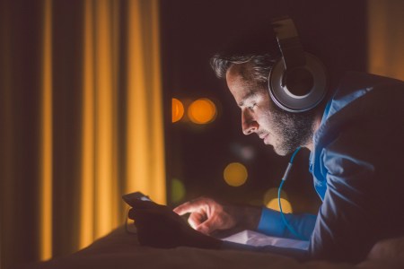 A man listens to music on headphones