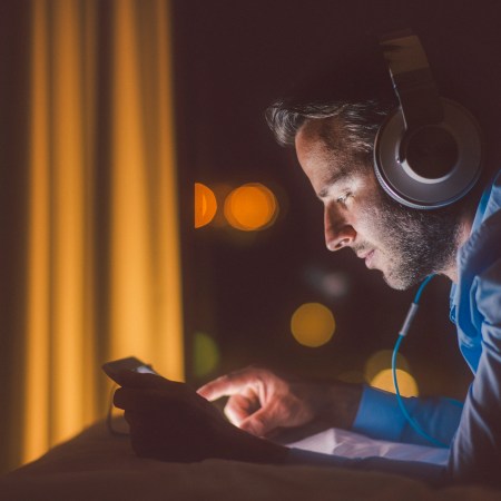 A man listens to music on headphones