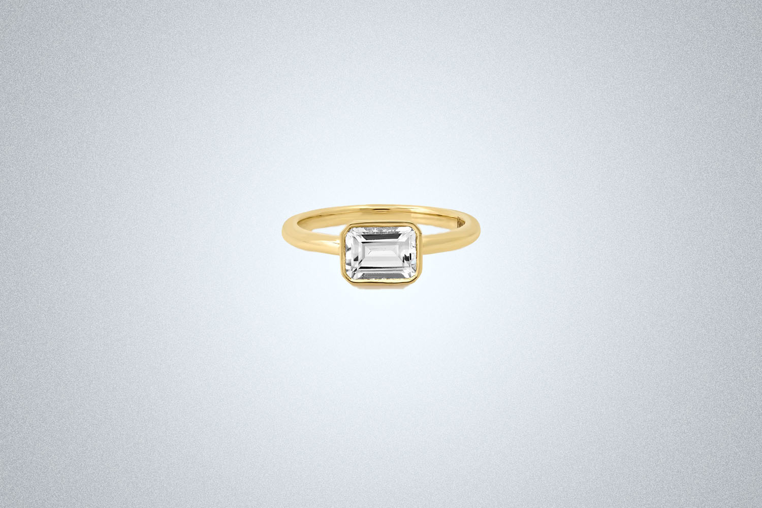 A Kinn The Sophia Engagement Ring on a gray background