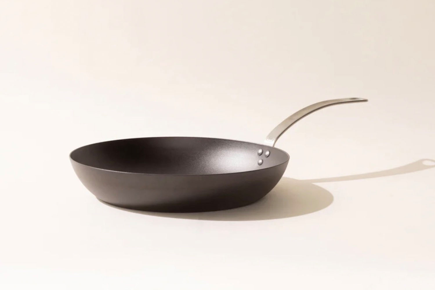 a cast iron Made In Skillet on a light tan background