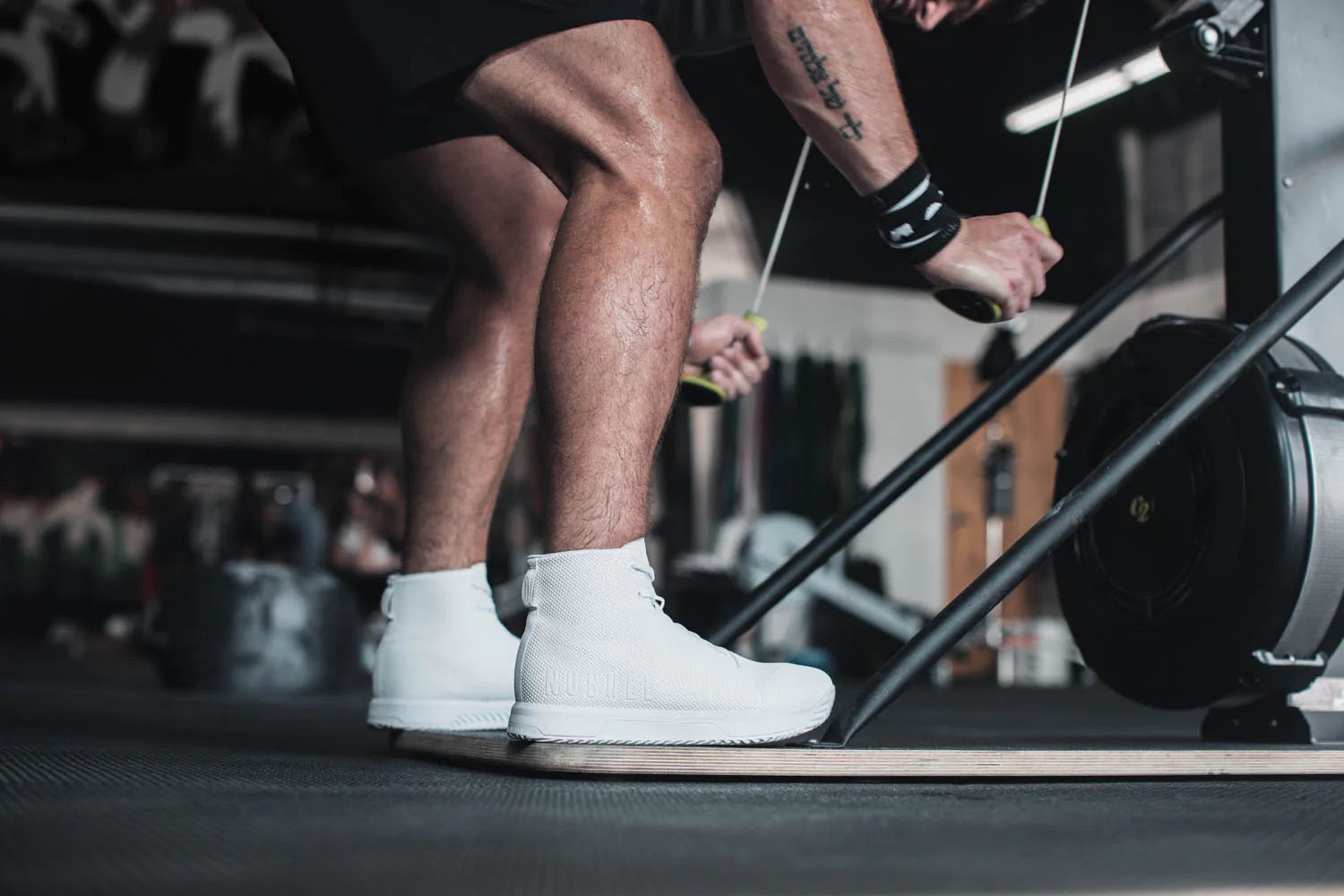 a model working out in a pair of NOBULL High-Top Trainers