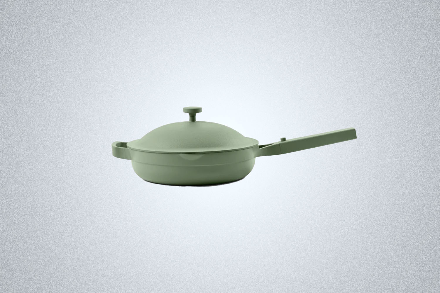 The Our Place Always Pan in green on a gray background