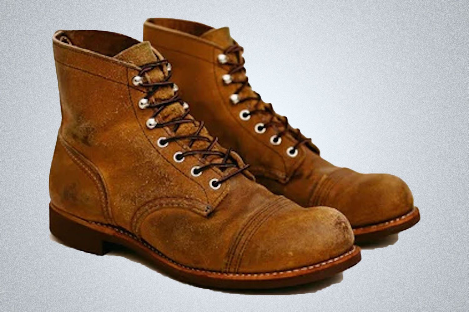 a pair of Red Wing Iron Ranger Leather Boots on a grey background