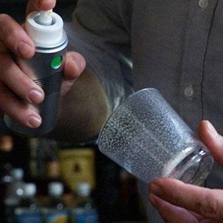 A person spraying from a Morgenthaler Triomphe Atomizer, a cool home bar tool from Cocktail Kingdom