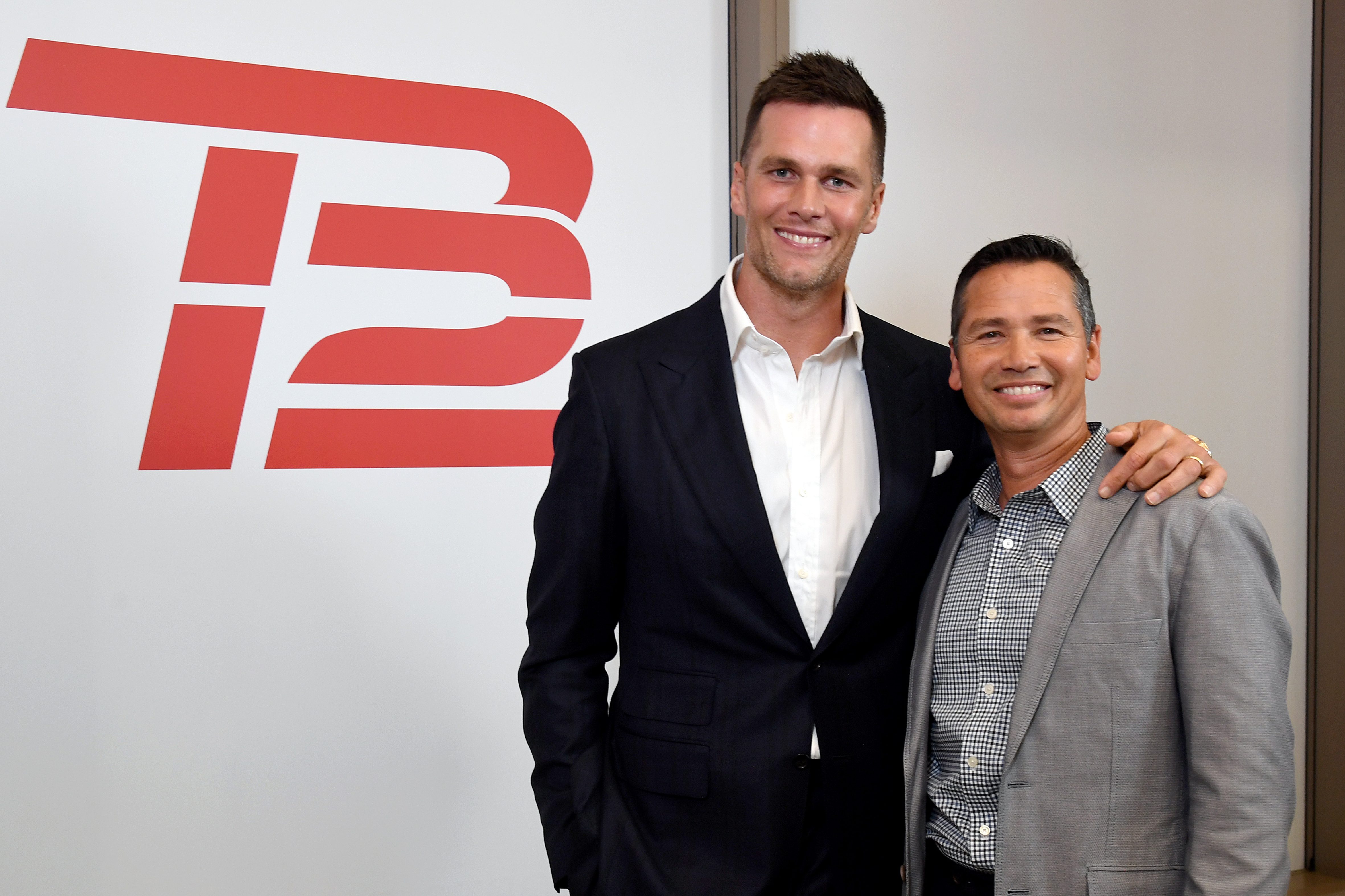 TB12 co-founders Tom Brady and Alex Guerrero celebrate the opening of a TB12 Center in 2019.