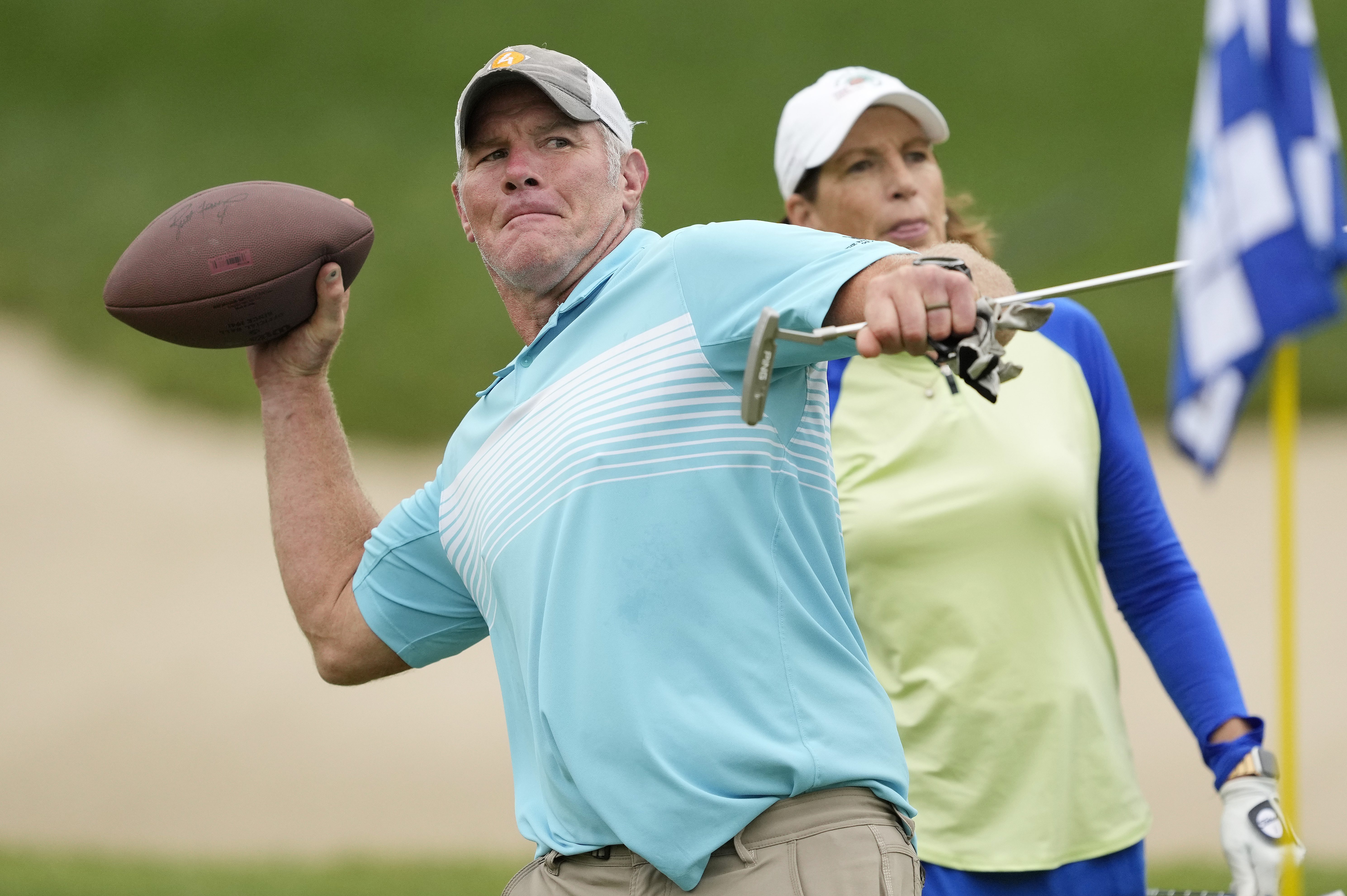 Ex-NFL player Brett Favre throws a football at the American Family Insurance Championship. His welfare scandal is growing with new information about donations from Favre 4 Hope.