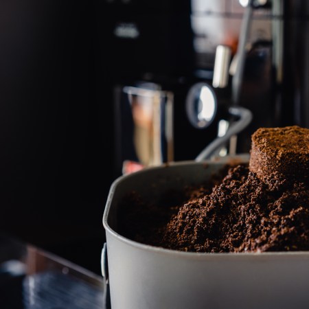 Leftover grounds resting in a pile on a coffee maker.