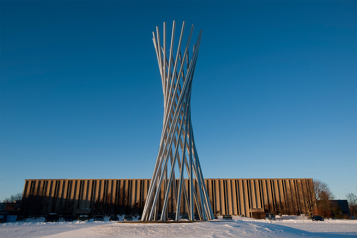 The Tractricious sculpture, located in front of the Industrial Center Building at Fermilab, was built from leftover Cryostat pipe from the construction of Tevatron magnets.