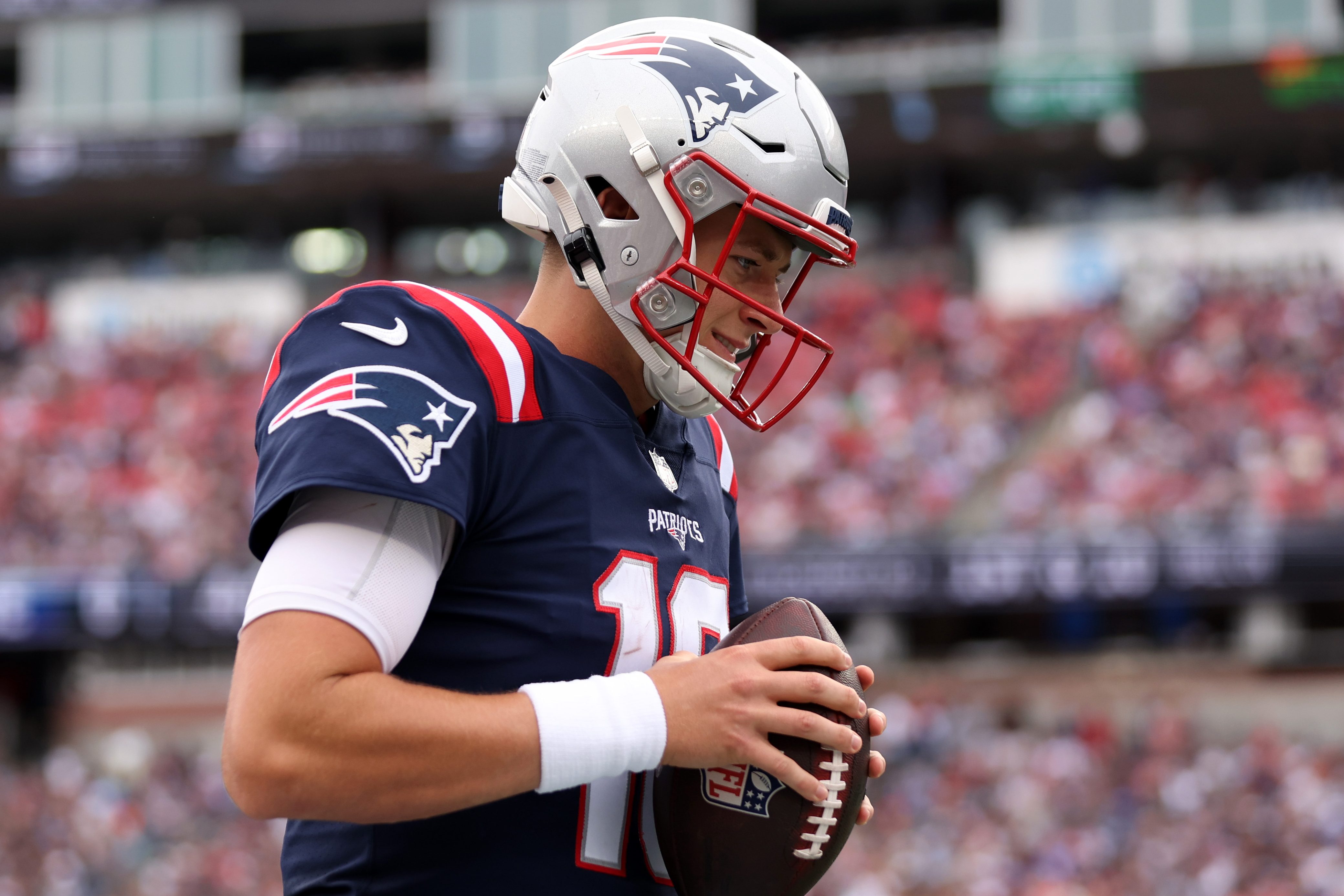 Mac Jones of the Patriots looks down during a game against the Ravens.