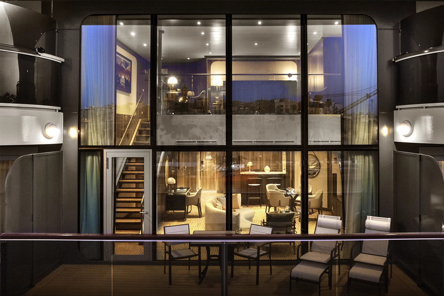 The two-level Wintergarden suite on the new Seabourn Venture cruise ship as seen from the outside at night