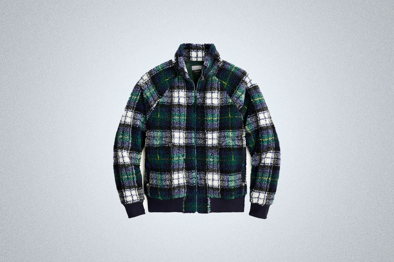 The J.Crew Nordic sherpa fleece hooded jacket in tartan on a gray background