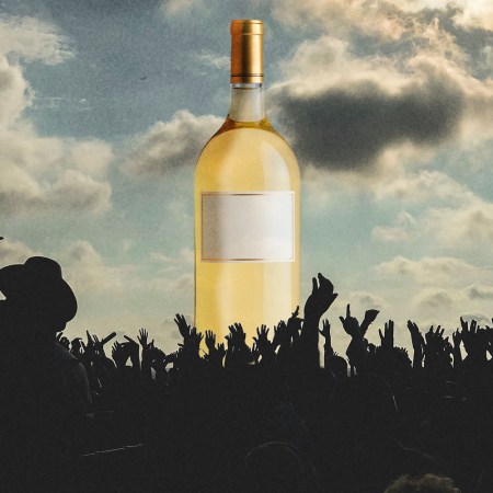 A Magnum sized bottle of wine in front of a festival -- magnums have more advantages than just a bigger size