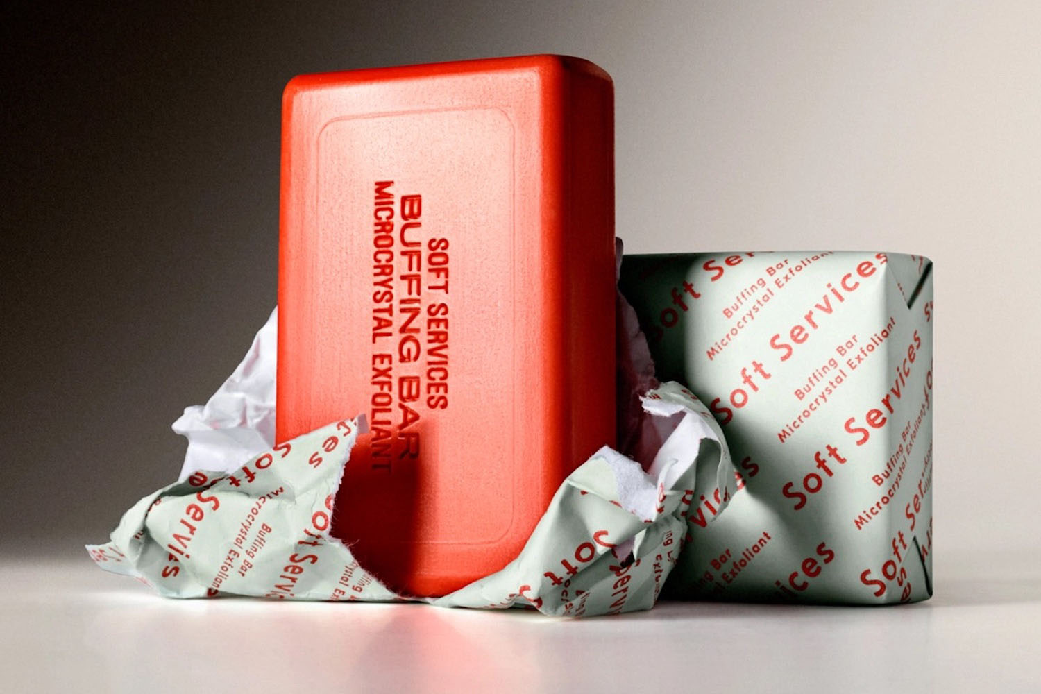 a red Soft Services buffing Bar on a grey background