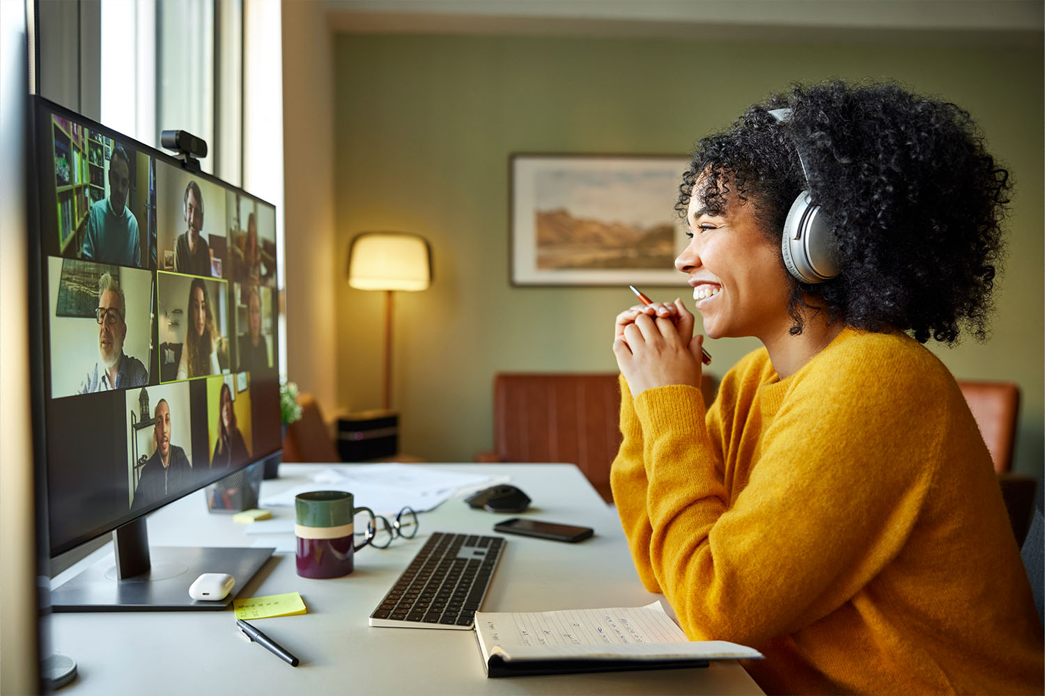 a woman stares at a computer