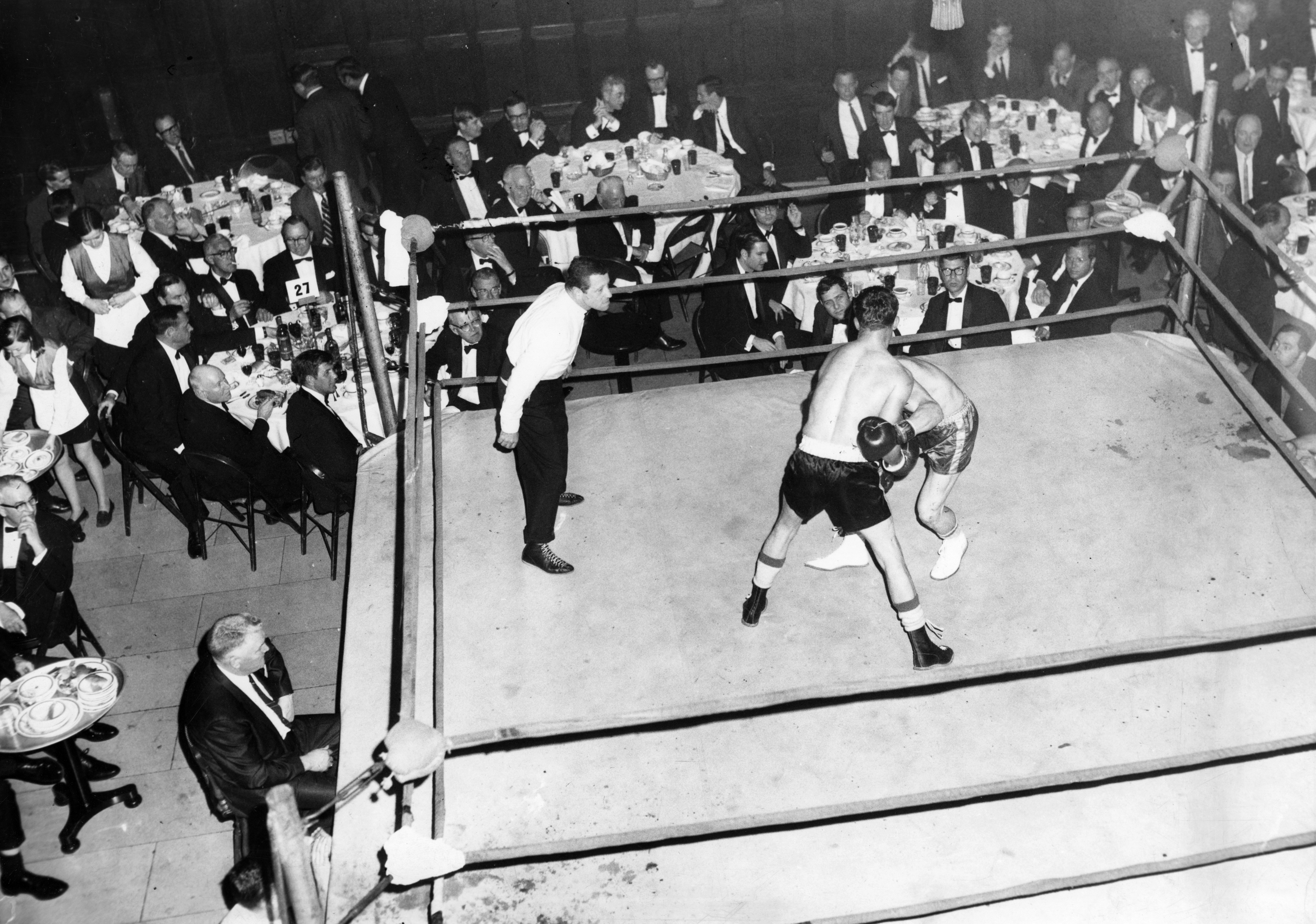 BOSTON, MA - MARCH 25: Members of the Harvard Club watch a boxing match during a "black tie fight" at the club in Boston on March 25, 1969.  (Photo by Charles B. Carey/The Boston Globe via Getty Images)