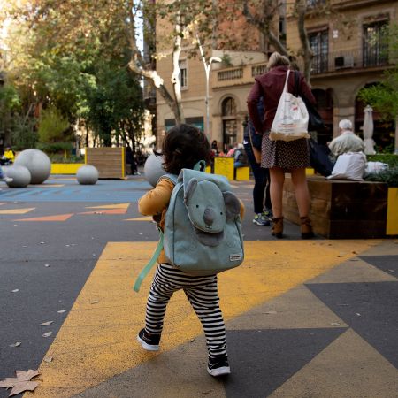 A child ambles through a "superilla" (superblock) plan promoting cycling and car-free zones in Barcelona. Could the concept work in the States?
