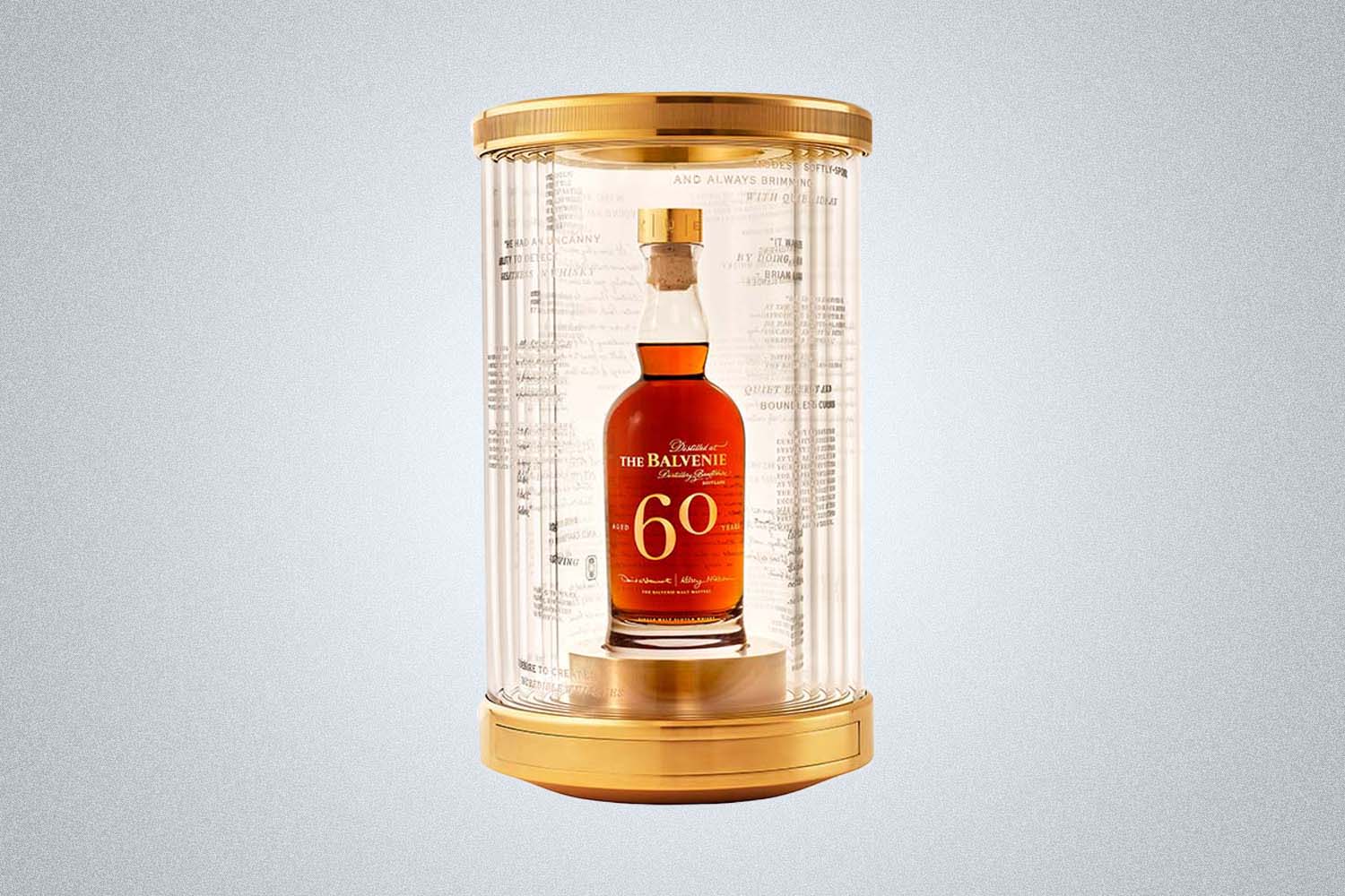 a bottle in a special case on a grey background