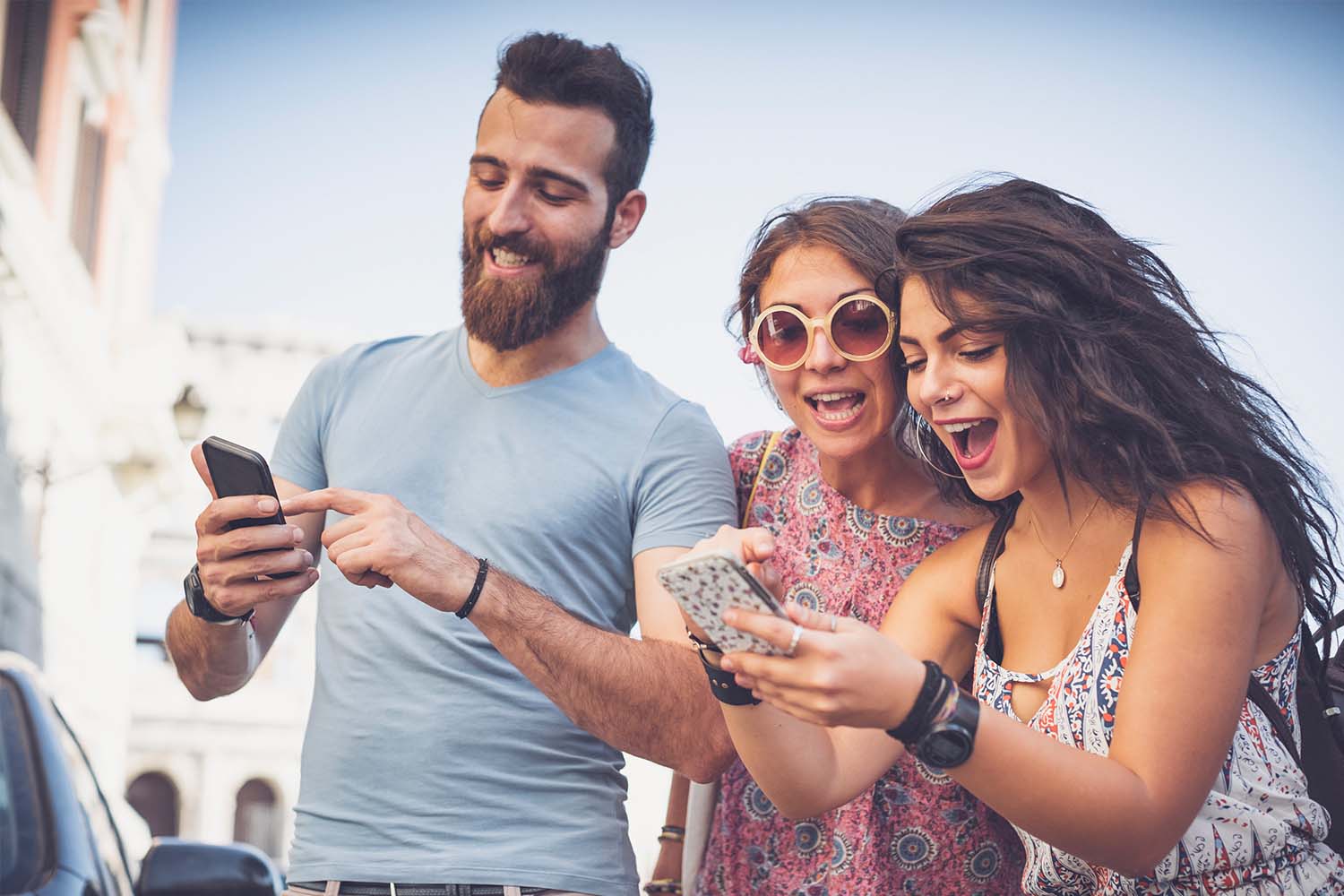 Friends placing bets on mobile phones