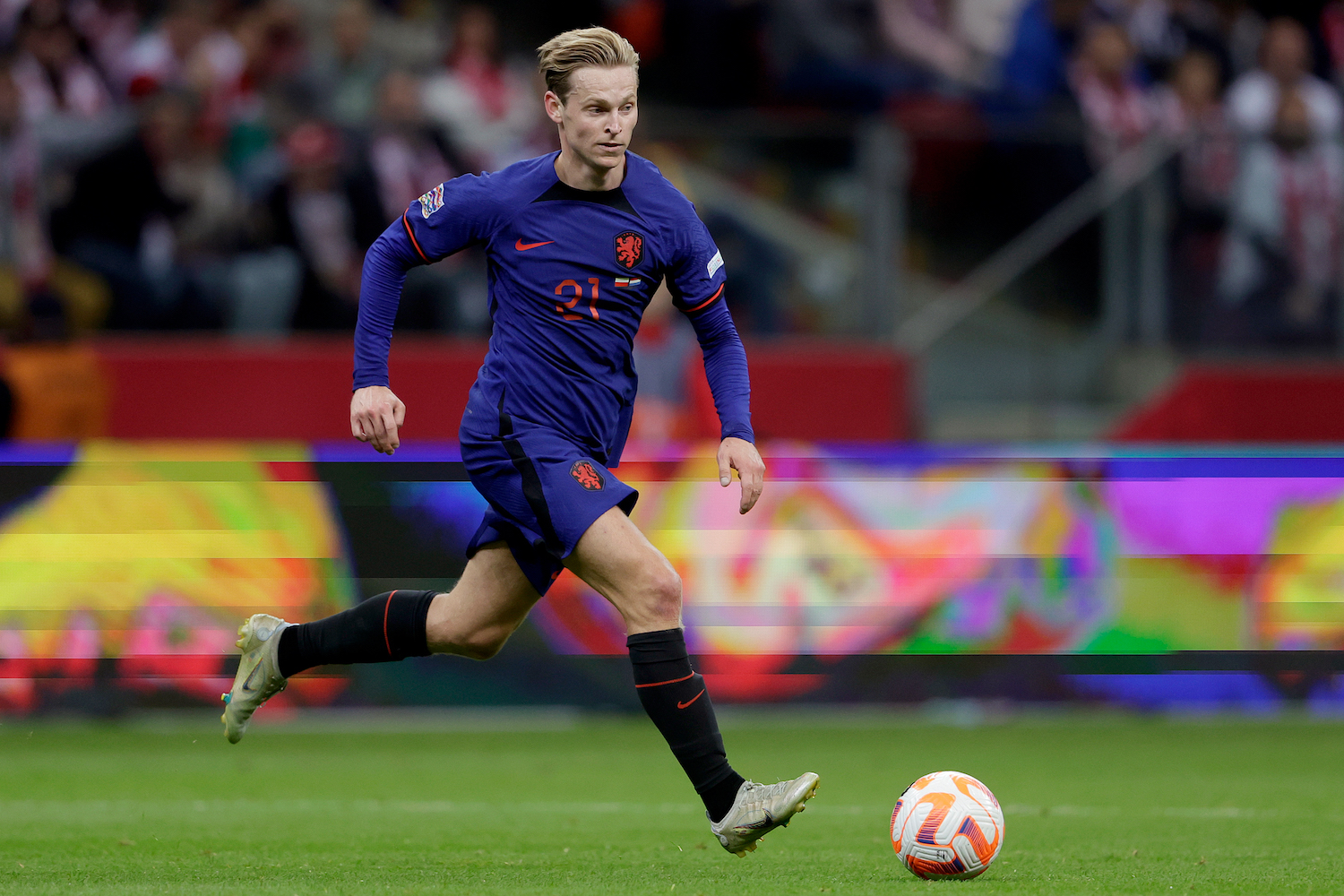 a soccer player in a blue jersey