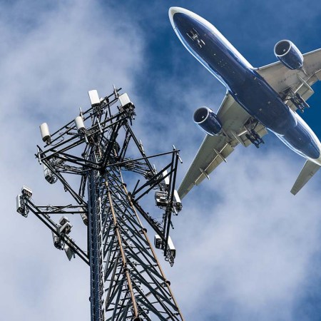 Mobile phone cell tower with 5G on the C Band frequencies with aircraft coming to land. Airlines worried about interference with plane altimeter, but the EU has opened the door for passenger use of 5G tech on properly equipped planes.