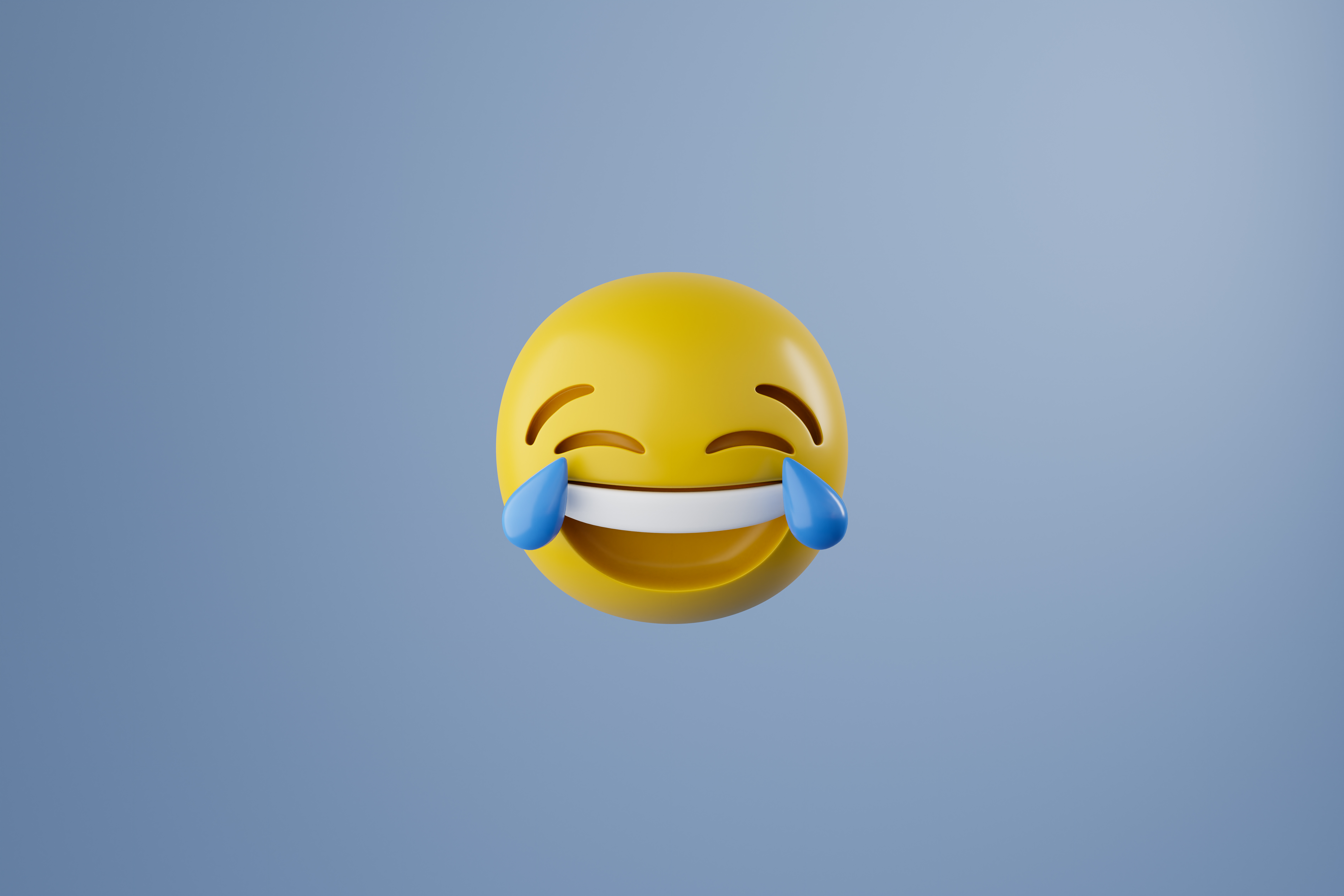 The crying laughing emoji against a blue background.