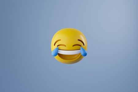 The crying laughing emoji against a blue background.