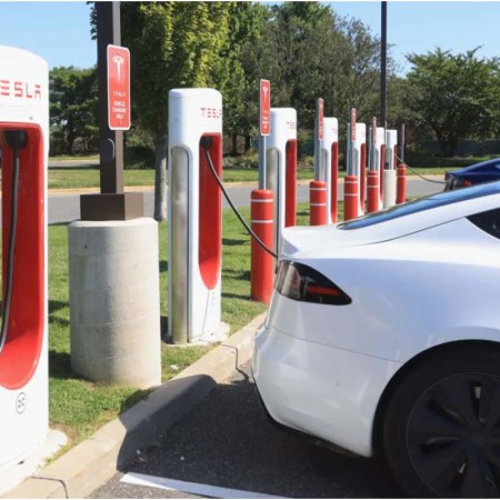 A Tesla car charging station in Garden City, New York. The carmakers has made multiple recalls recently.