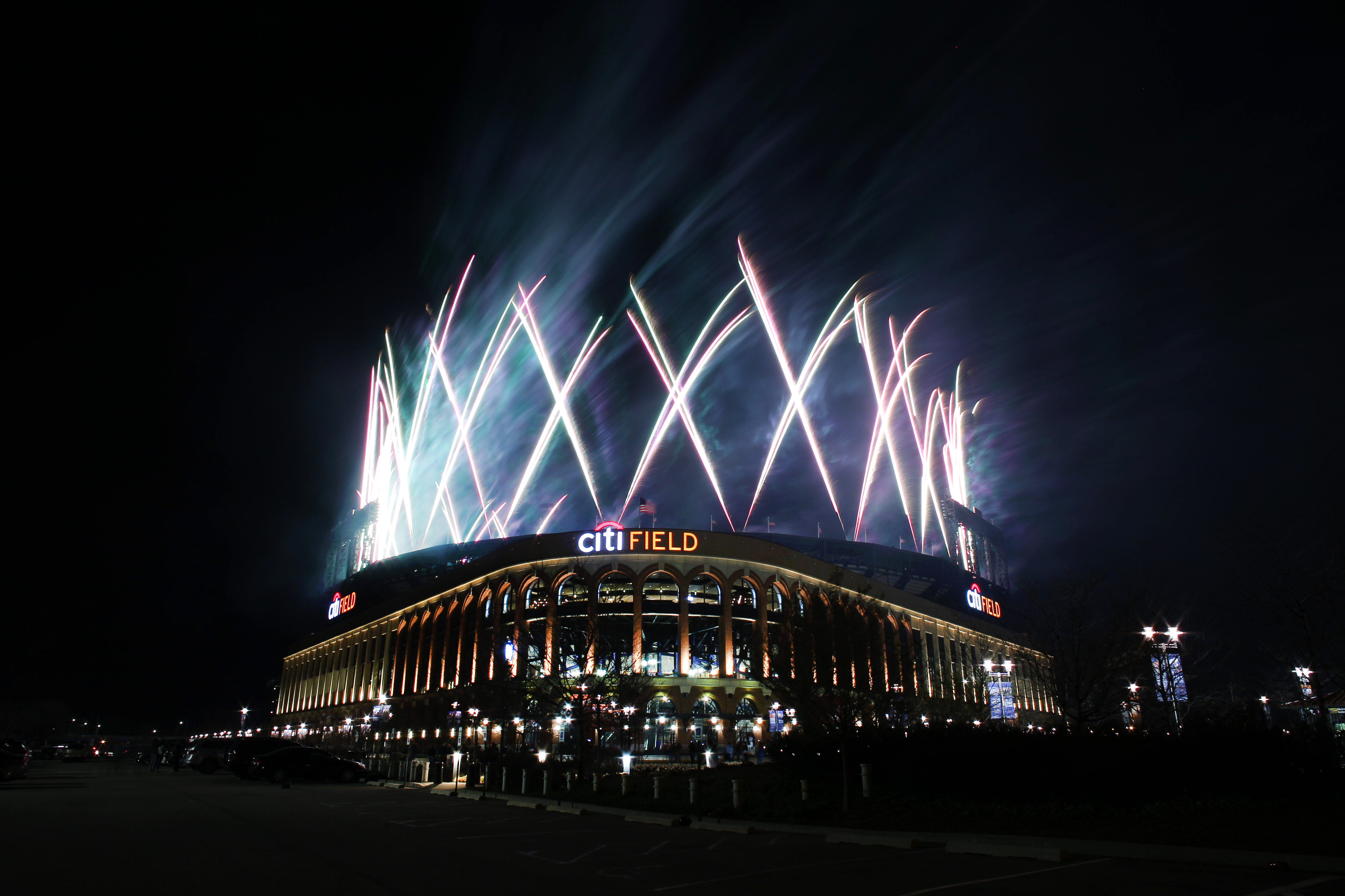 Citi Field, the home of the New York Mets, at night with fireworks shooting into the sky