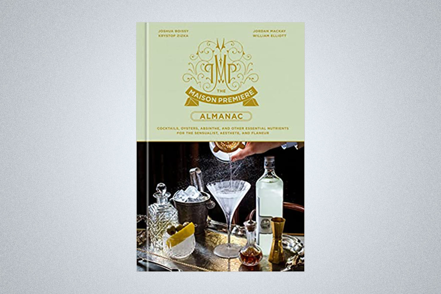 a green cookbook on a grey background