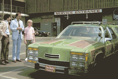 A scene from "National Lampoon's Vacation" with Clark Griswold standing next to the Family Truckster station wagon, which morphs into a Toyota RAV4 SUV