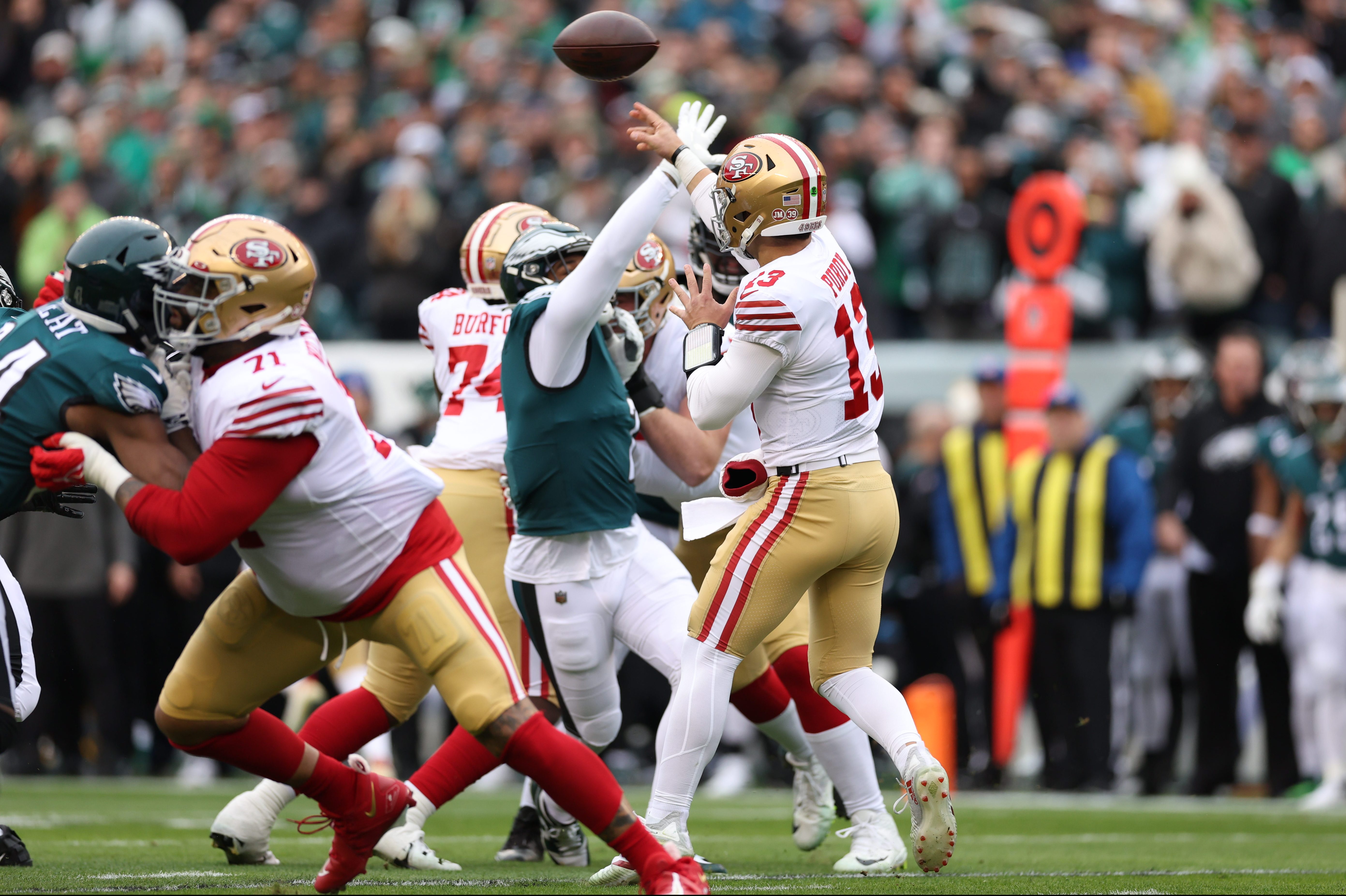 Brock Purdy attempts a throw against the Eagles.