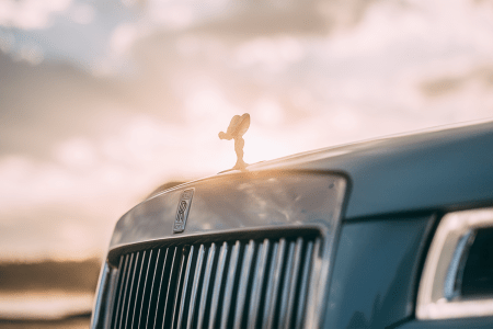 A Rolls-Royce Ghost that's part of the automaker's Pebble Beach Collection, zoomed in on the Spirit of Ecstasy, the brand's mascot