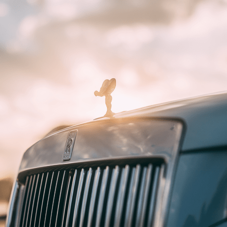 A Rolls-Royce Ghost that's part of the automaker's Pebble Beach Collection, zoomed in on the Spirit of Ecstasy, the brand's mascot