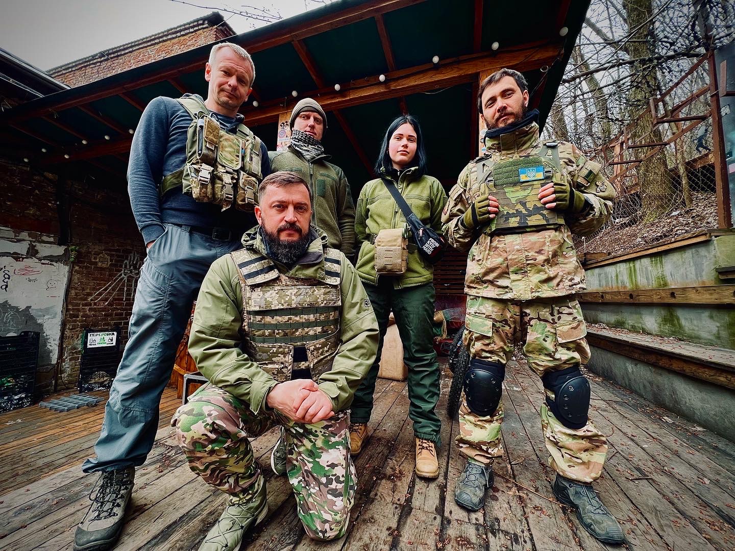 a bunch of men in army fatigues in Kyiv