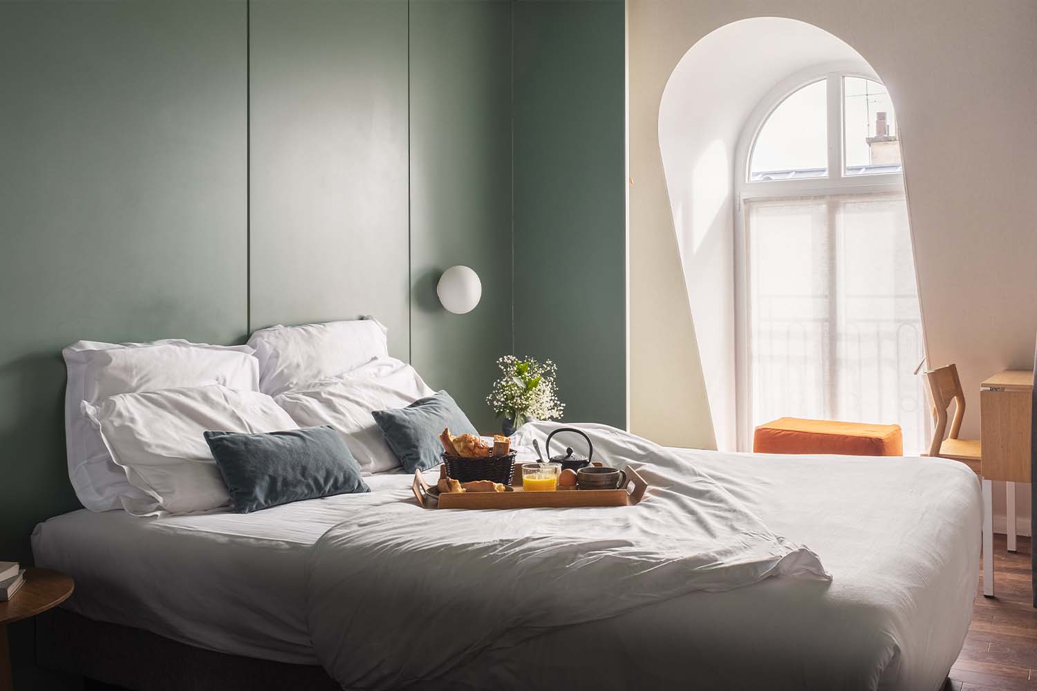 A guest room at Hotel Cabane, with breakfast on the bed