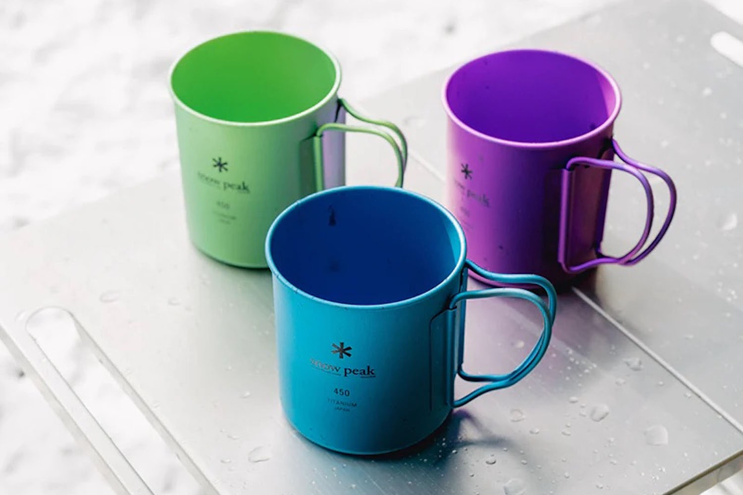 a collage of Snow Peak cups outside