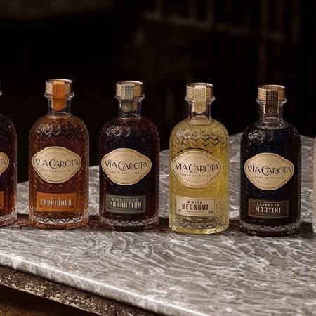 Via Carota's six bottled cocktails on a table