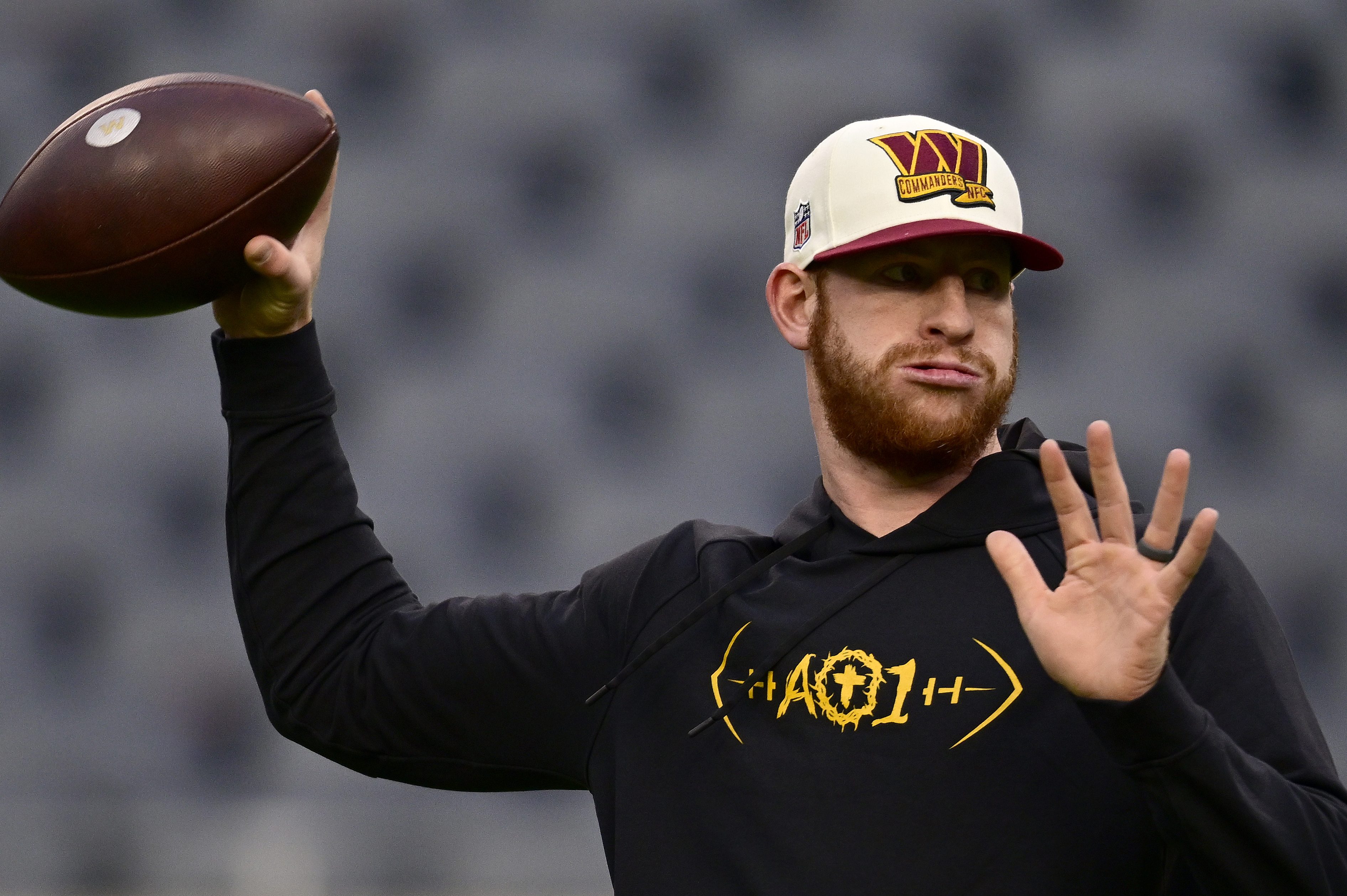 Carson Wentz warms up before a game against the Bears.