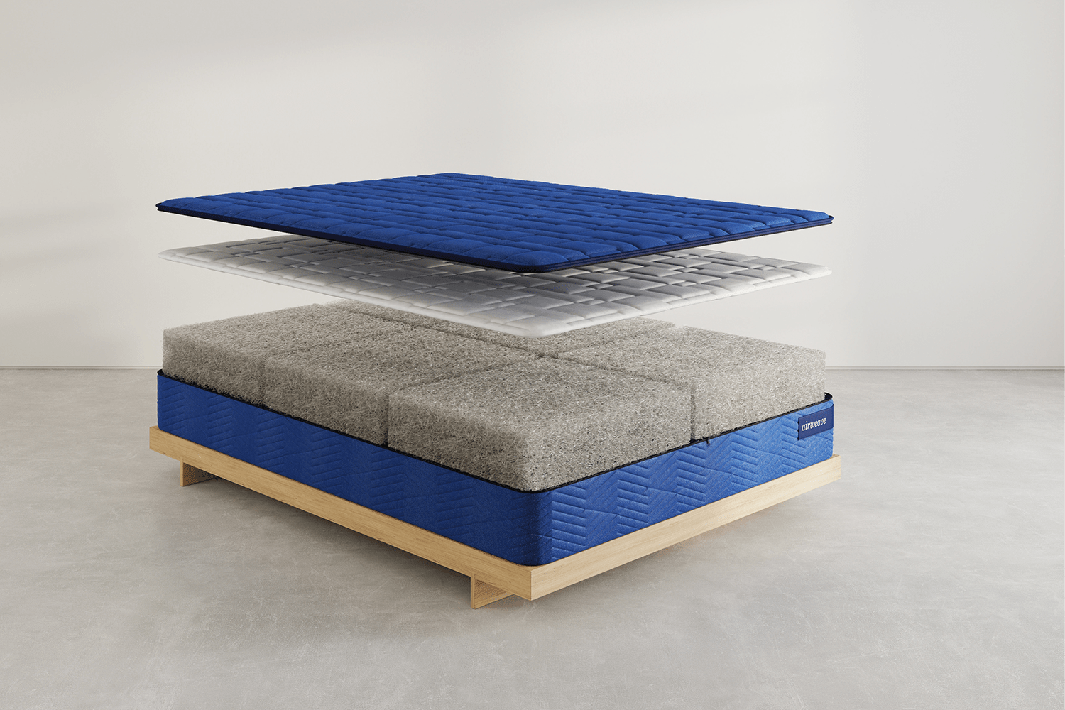 an image of a mattress split into parts to reveal its construction with four total layers