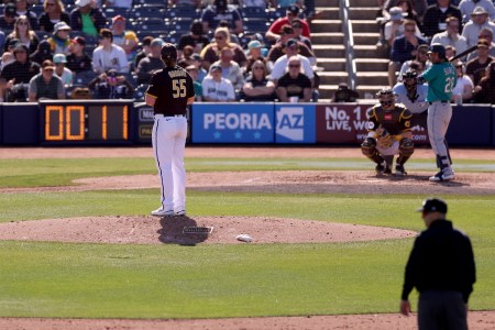 A pitch clock counts down as Jay Groome #55 of the San Diego Padres prepares to deliver a pitch to Eugenio Suarez #28 of the Seattle Mariners during the sixth inning in a spring training game at Peoria Stadium on February 24, 2023 in Peoria, Arizona.