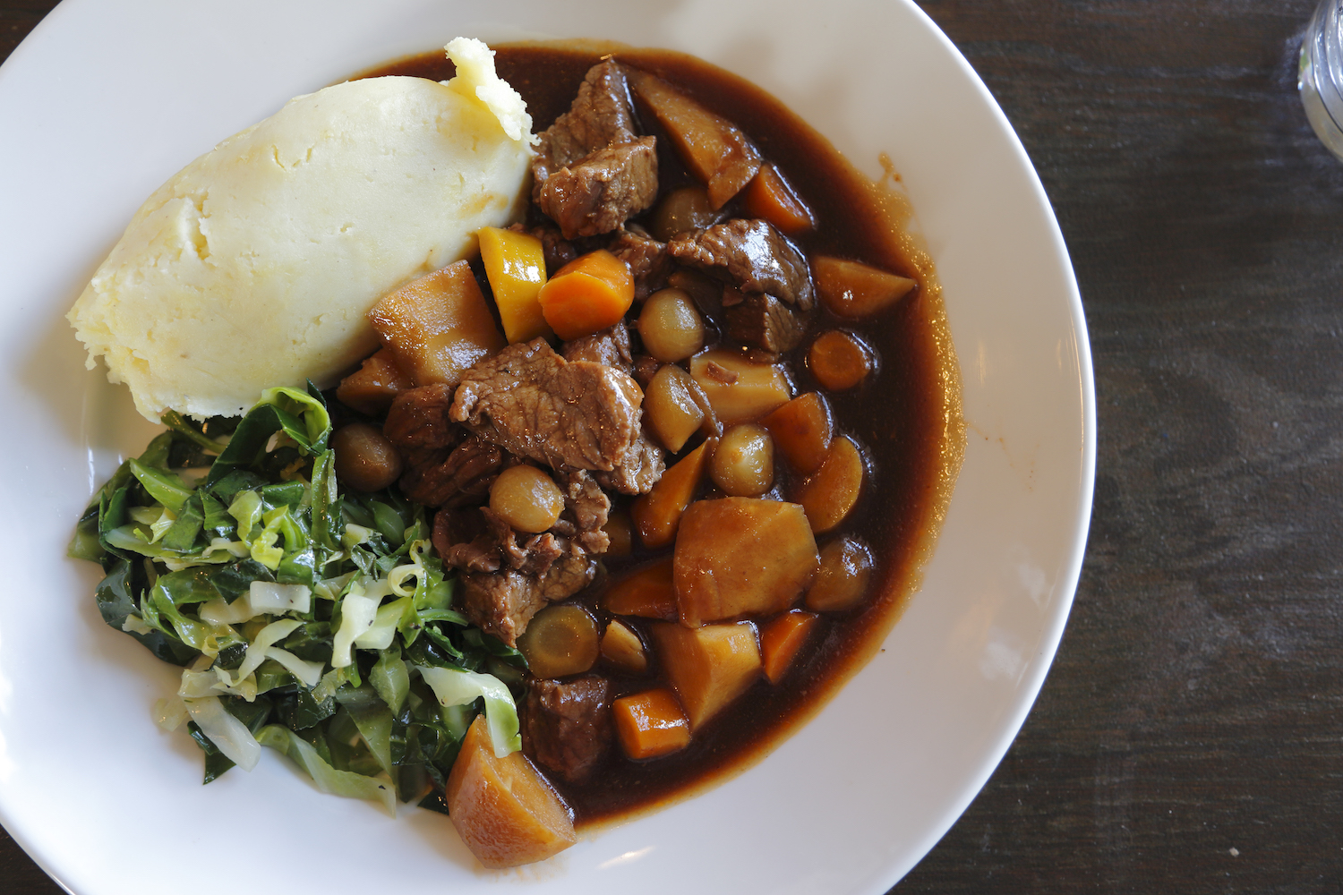 Traditional Irish beef stew in a white bowl