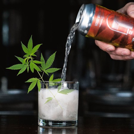 A THC seltzer being poured into a glass