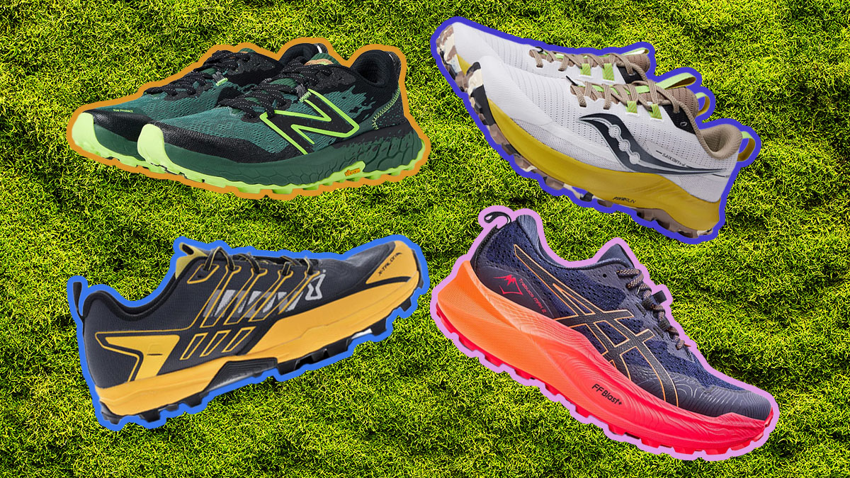 Four trail running shoes on a grass background