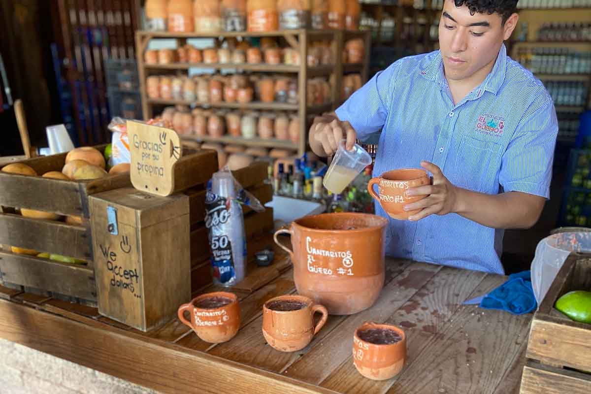 A bartender making a cantarito at Cantaritos El Güero