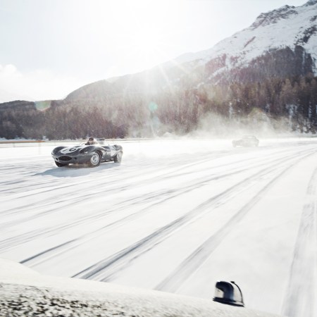 Classic cars drifting on the frozen Lake St. Moritz at The Ice, a concours event in winter