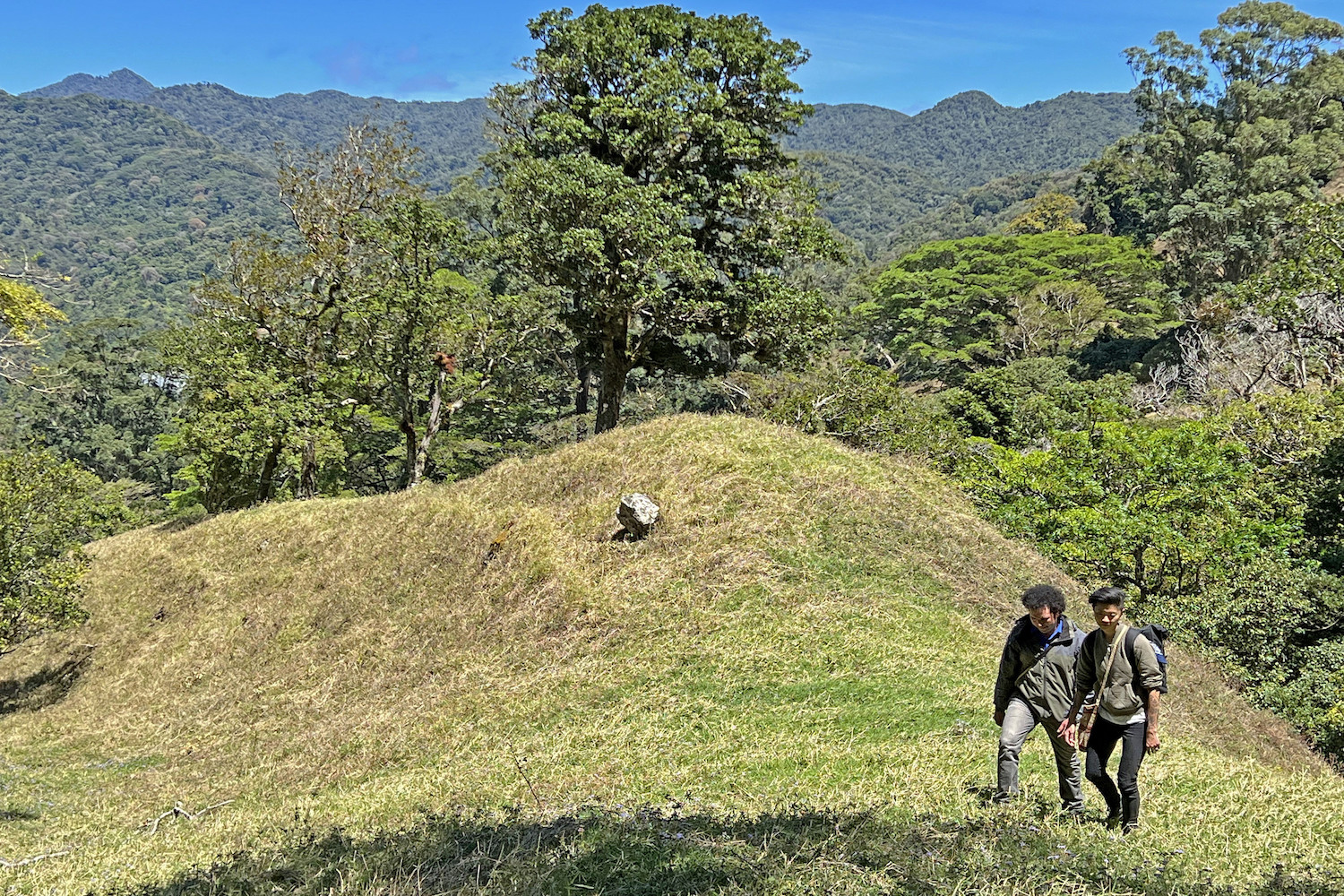 Chef Kristen Kish and restaurant owner and Chef Rolando Chamorro hike up a mountain