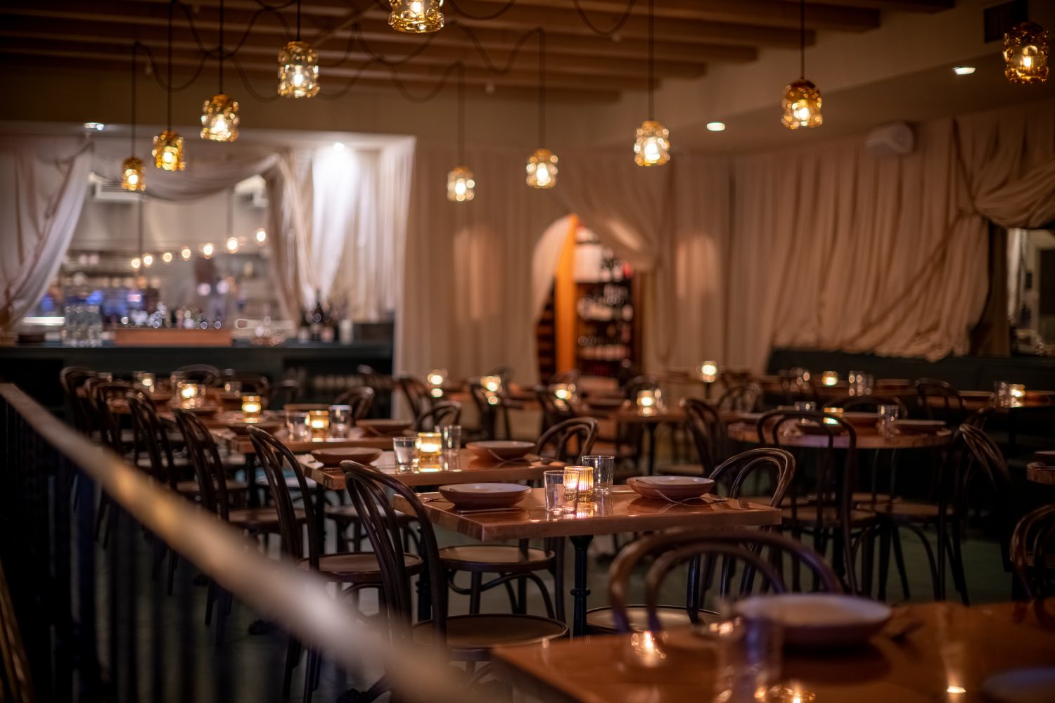 A dimly lit dining room at a restaurant