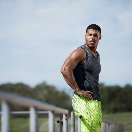 A photograph of fitness trainer Ron "Boss" Everline standing with his hands on his hips.
