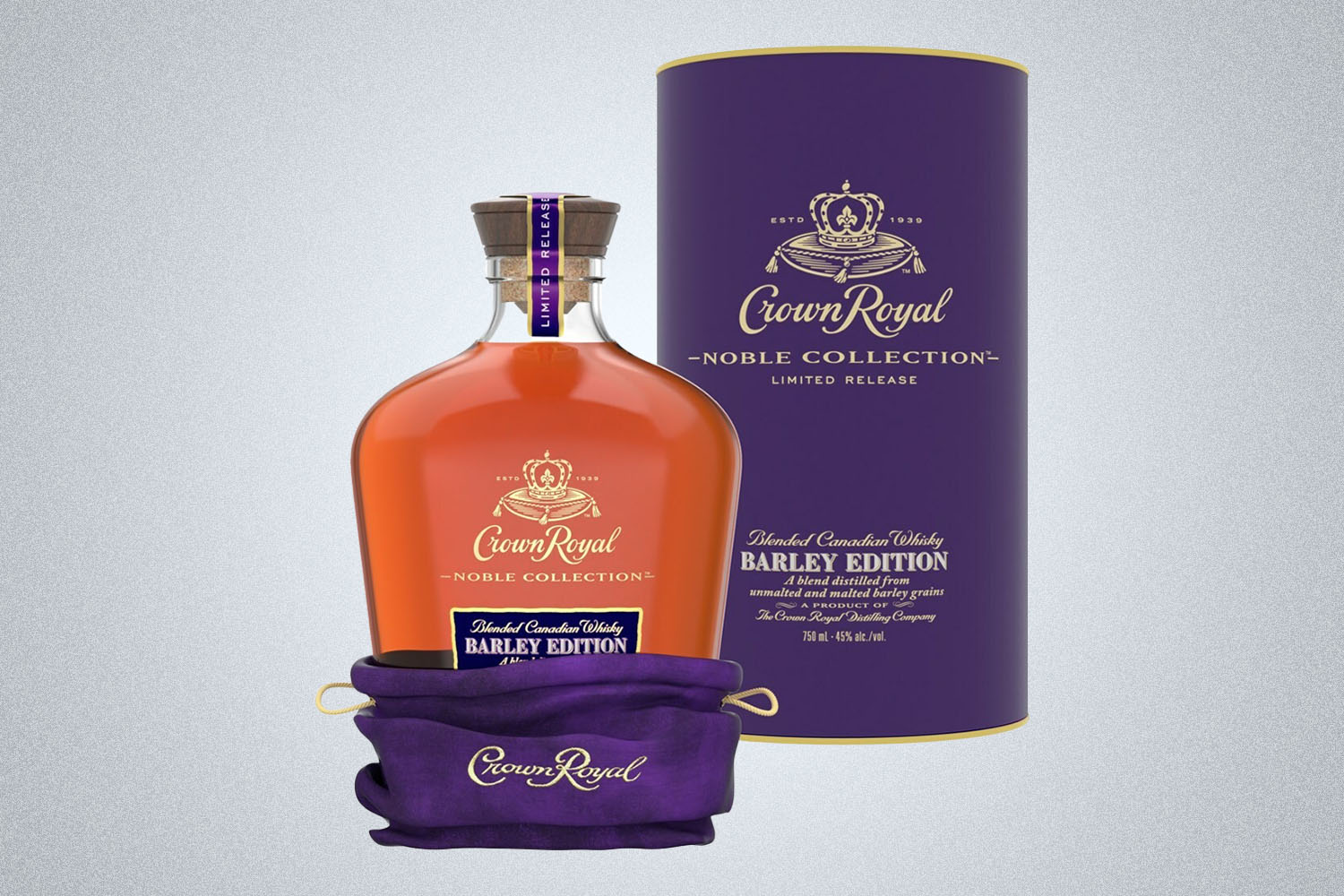 a bottle and case of Crown Royal on a grey background